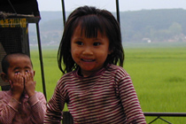 210px-Yunnan-girl-on-flatbed